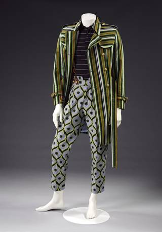 black, brown, green and white striped cotton trench coat with belt, blue-grey poplin trousers with a black and yellow pattern