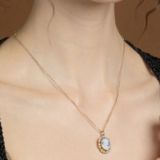 Hand-carved porcelain cameo necklace by Vintouch
