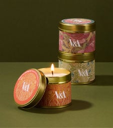 Scented V&A tin candles featuring exclusive floral patterns from the Museum's archive.